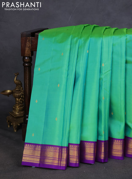 Pure kanchipuram silk saree teal green and violet with zari woven buttas and zari woven korvai border