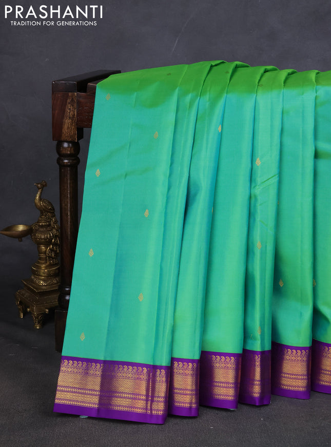 Pure kanchipuram silk saree teal green and violet with zari woven buttas and zari woven korvai border