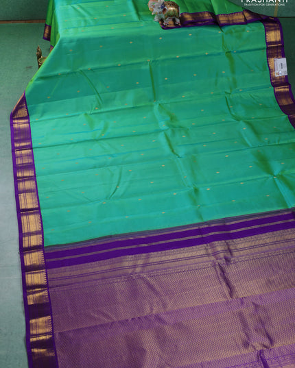 Pure kanchipuram silk saree teal green and violet with zari woven buttas and zari woven korvai border
