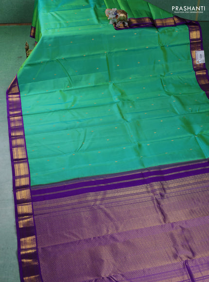 Pure kanchipuram silk saree teal green and violet with zari woven buttas and zari woven korvai border