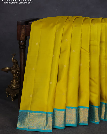 Pure kanchipuram silk saree lime yellow and teal blue with zari woven buttas and zari woven korvai border