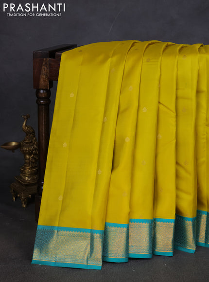 Pure kanchipuram silk saree lime yellow and teal blue with zari woven buttas and zari woven korvai border