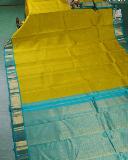 Pure kanchipuram silk saree lime yellow and teal blue with zari woven buttas and zari woven korvai border