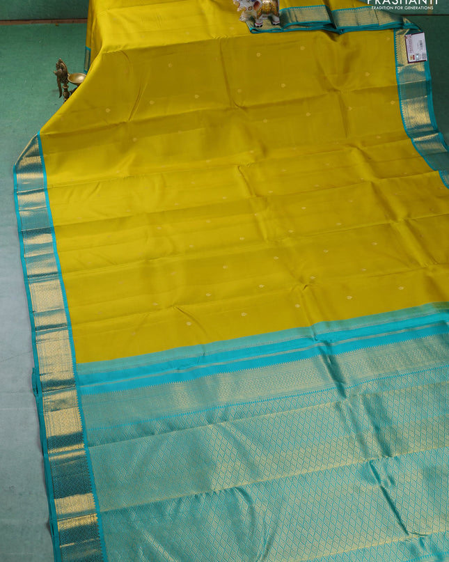 Pure kanchipuram silk saree lime yellow and teal blue with zari woven buttas and zari woven korvai border