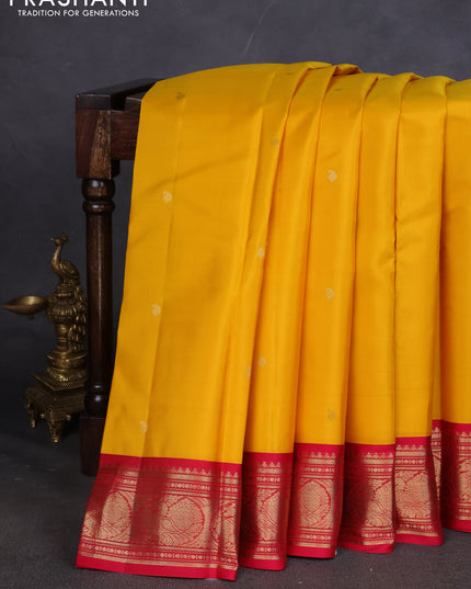 Pure kanchipuram silk saree yellow and dark pink with paisley zari woven buttas and zari woven korvai border