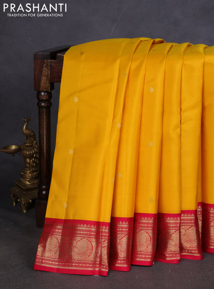 Pure kanchipuram silk saree yellow and dark pink with paisley zari woven buttas and zari woven korvai border