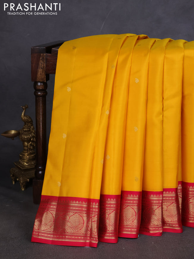 Pure kanchipuram silk saree yellow and dark pink with paisley zari woven buttas and zari woven korvai border