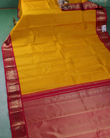 Pure kanchipuram silk saree yellow and dark pink with paisley zari woven buttas and zari woven korvai border