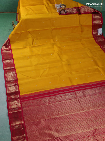 Pure kanchipuram silk saree yellow and dark pink with paisley zari woven buttas and zari woven korvai border