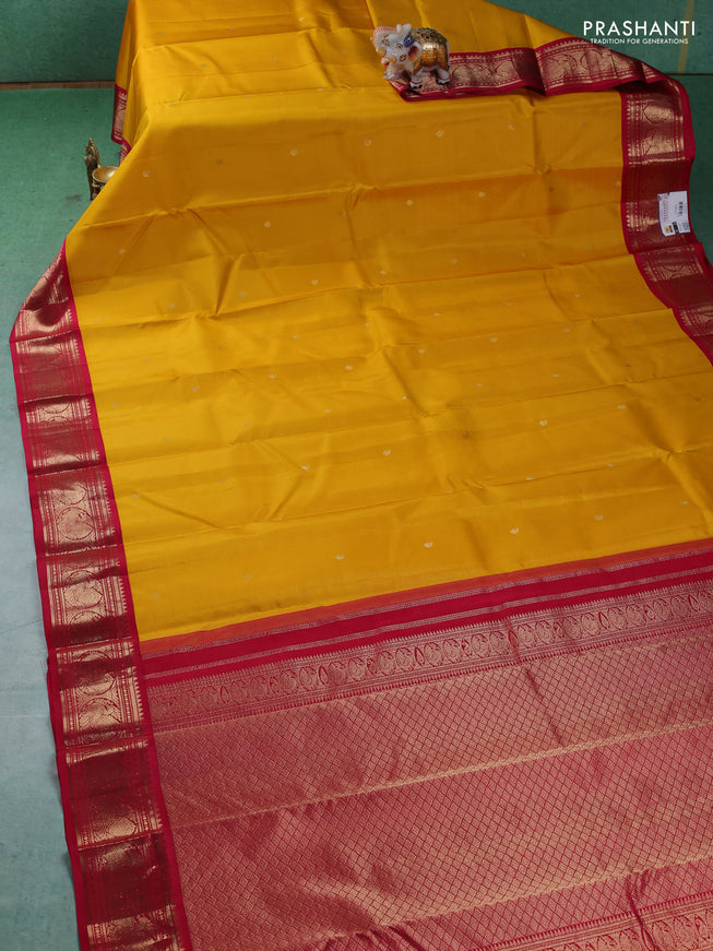 Pure kanchipuram silk saree yellow and dark pink with paisley zari woven buttas and zari woven korvai border