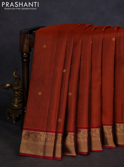 Pure kanchipuram silk saree rust shade and maroon with allover zari weaves and zari woven korvai border