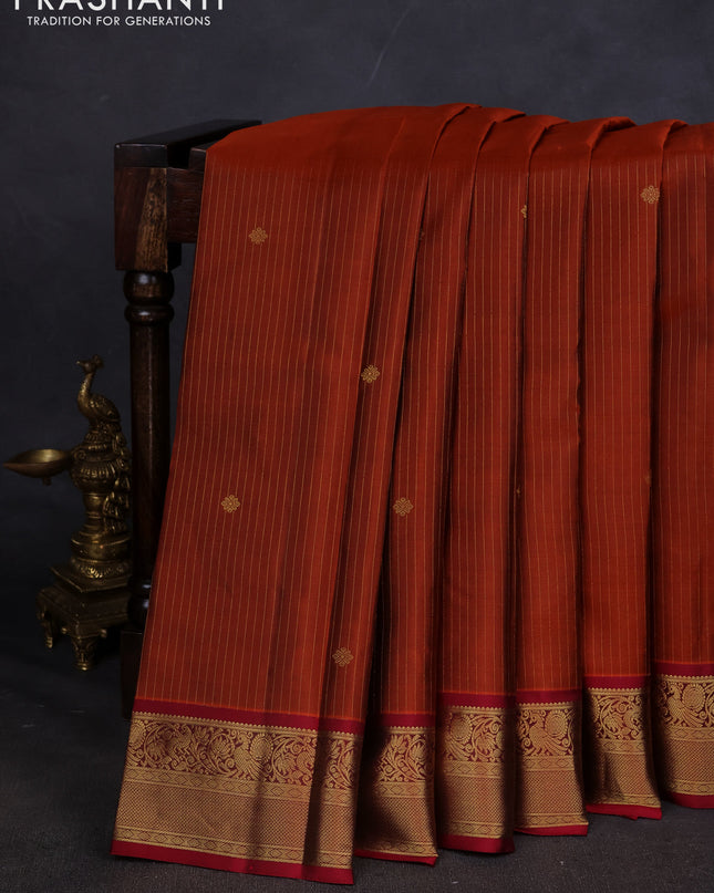 Pure kanchipuram silk saree rust shade and maroon with allover zari weaves and zari woven korvai border