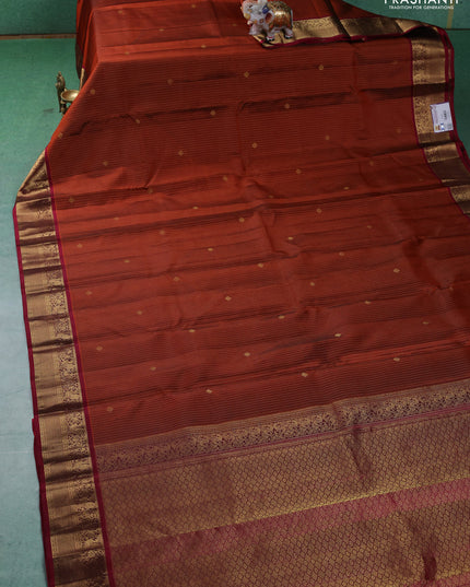 Pure kanchipuram silk saree rust shade and maroon with allover zari weaves and zari woven korvai border