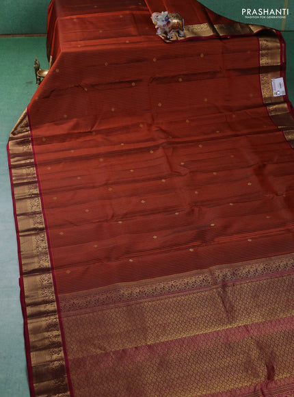 Pure kanchipuram silk saree rust shade and maroon with allover zari weaves and zari woven korvai border