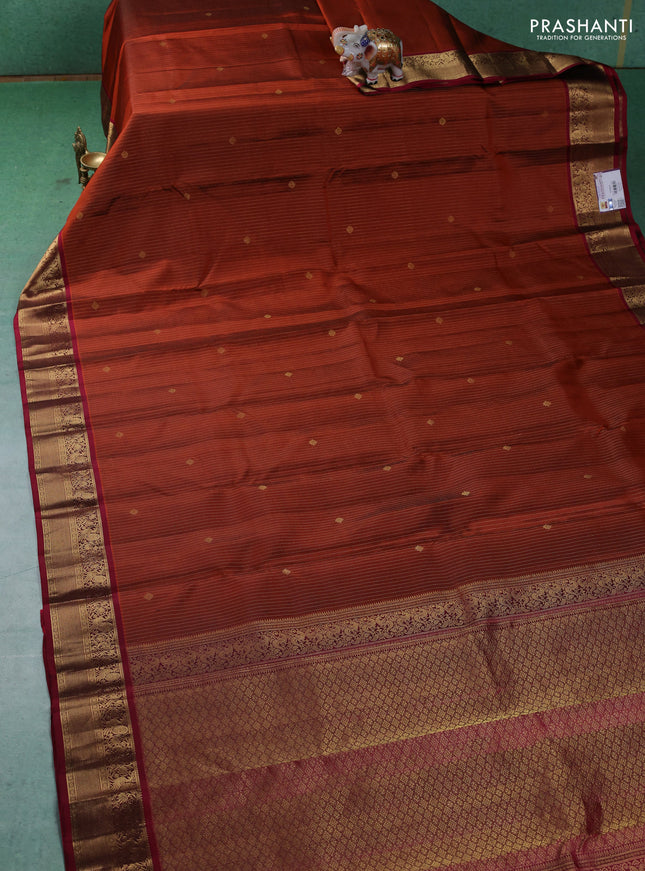 Pure kanchipuram silk saree rust shade and maroon with allover zari weaves and zari woven korvai border