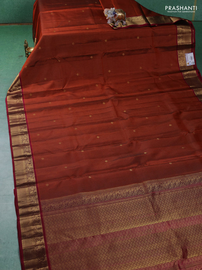 Pure kanchipuram silk saree rust shade and maroon with allover zari weaves and zari woven korvai border