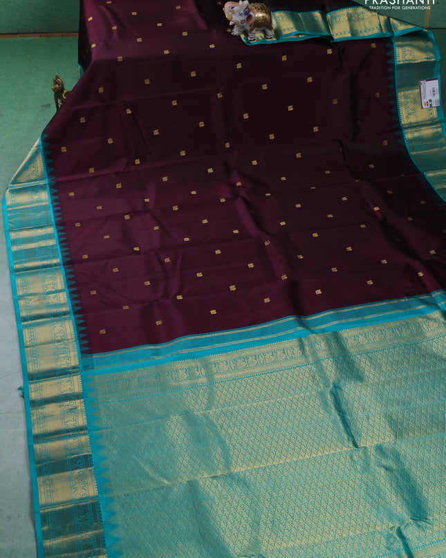 Pure kanchipuram silk saree deep wine and teal blue with annam zari woven buttas and zari woven korvai border