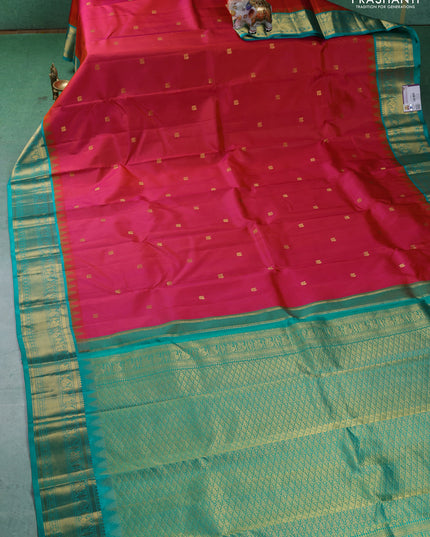 Pure kanchipuram silk saree dual shade of pinkish orange and teal blue with annam zari woven buttas and zari woven korvai border