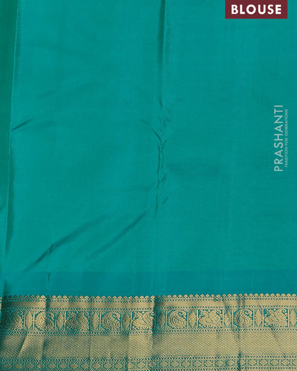 Pure kanchipuram silk saree dual shade of pinkish orange and teal blue with annam zari woven buttas and zari woven korvai border
