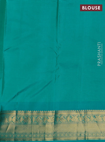 Pure kanchipuram silk saree dual shade of pinkish orange and teal blue with annam zari woven buttas and zari woven korvai border