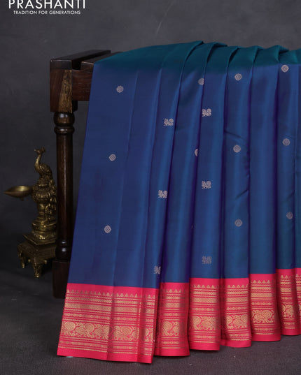 Pure kanchipuram silk saree blue and pink shade with zari woven buttas and zari woven korvai border