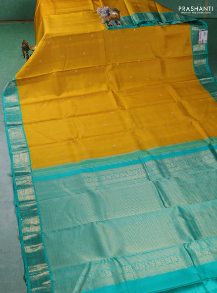 Pure kanchipuram silk saree mustard yellow and teal blue with allover zari weaves & buttas and zari woven korvai border