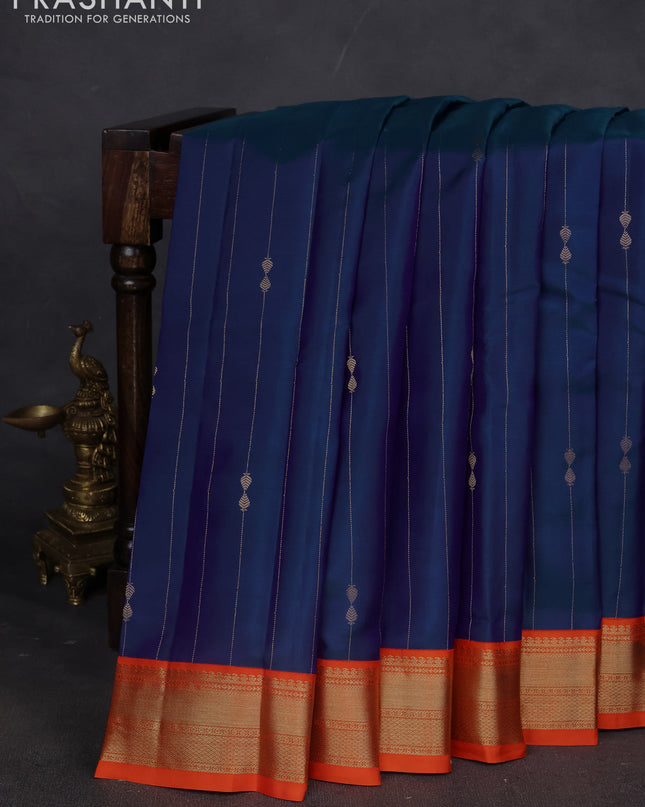 Pure kanchipuram silk saree dual shade of blue and orange with allover zari weaves & buttas and zari woven korvai border