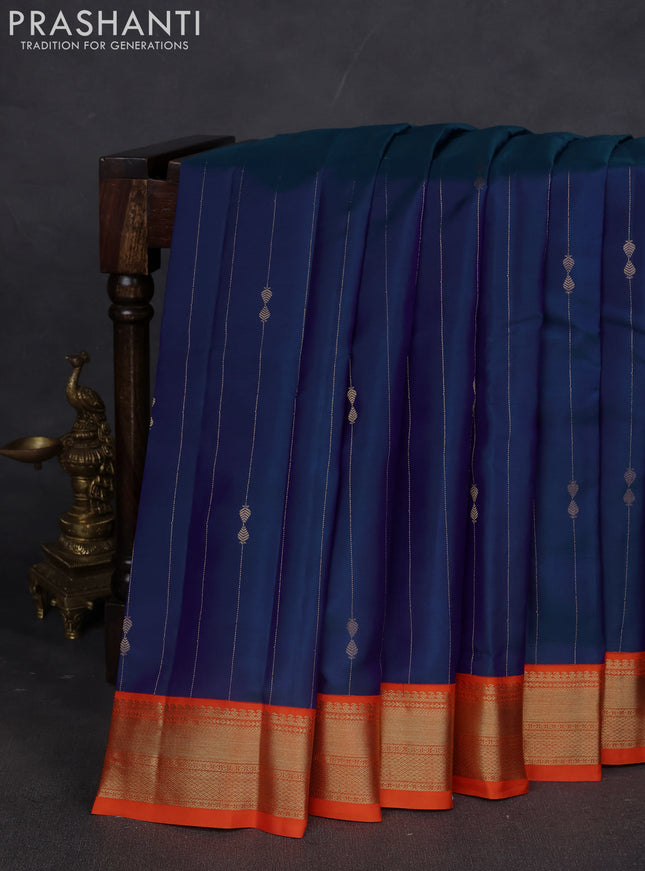 Pure kanchipuram silk saree dual shade of blue and orange with allover zari weaves & buttas and zari woven korvai border