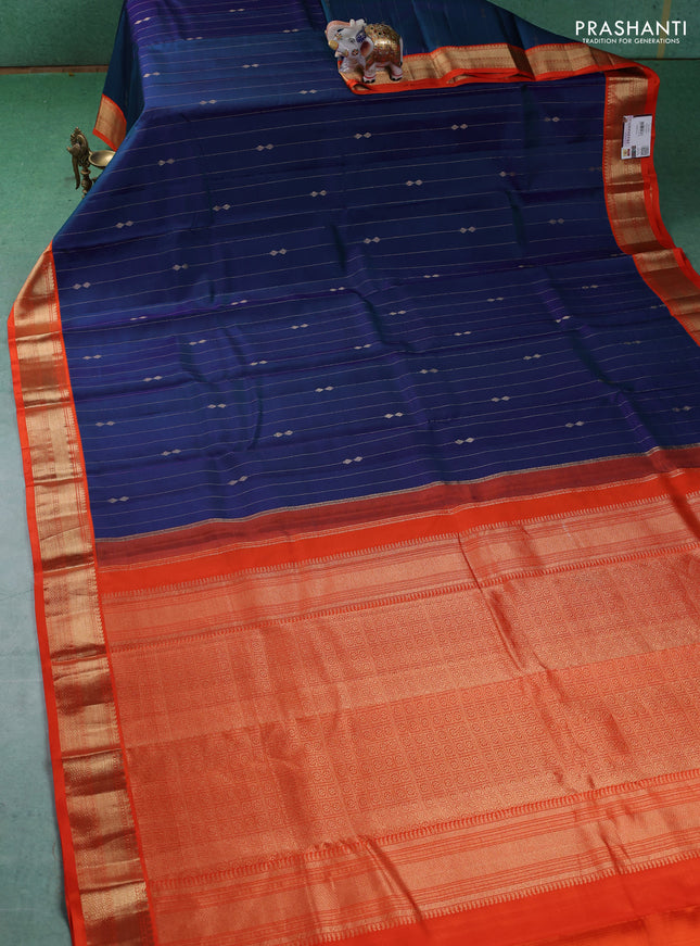 Pure kanchipuram silk saree dual shade of blue and orange with allover zari weaves & buttas and zari woven korvai border