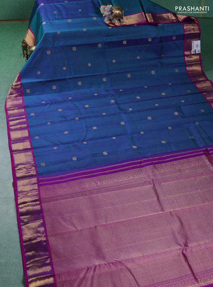 Pure kanchipuram silk saree peacock blue and purple with allover zari checks & buttas and zari woven border