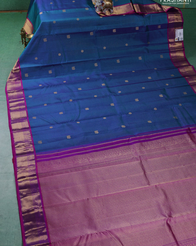 Pure kanchipuram silk saree peacock blue and purple with allover zari checks & buttas and zari woven border