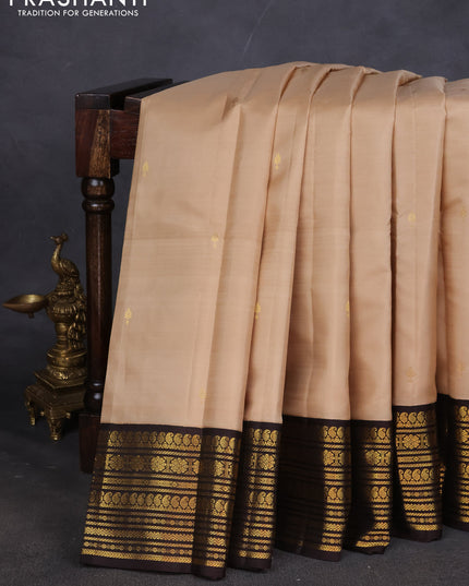 Pure kanchipuram silk saree beige and coffee brown with zari woven buttas and zari woven korvai border