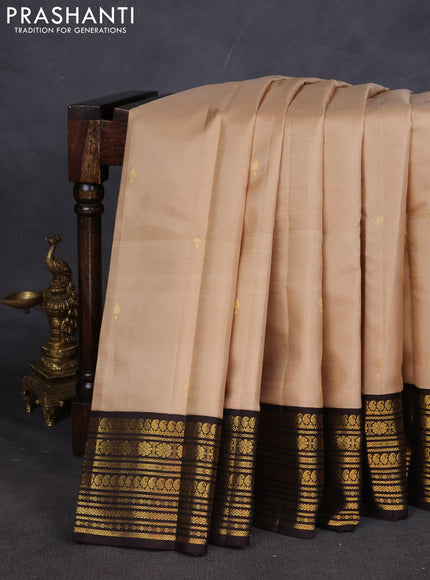Pure kanchipuram silk saree beige and coffee brown with zari woven buttas and zari woven korvai border