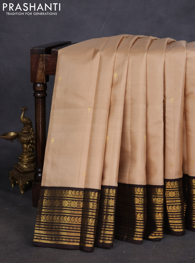 Pure kanchipuram silk saree beige and coffee brown with zari woven buttas and zari woven korvai border