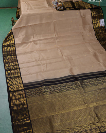 Pure kanchipuram silk saree beige and coffee brown with zari woven buttas and zari woven korvai border