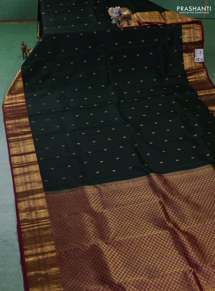 Pure kanchipuram silk saree bottle green and dark magenta with zari woven buttas and zari woven border