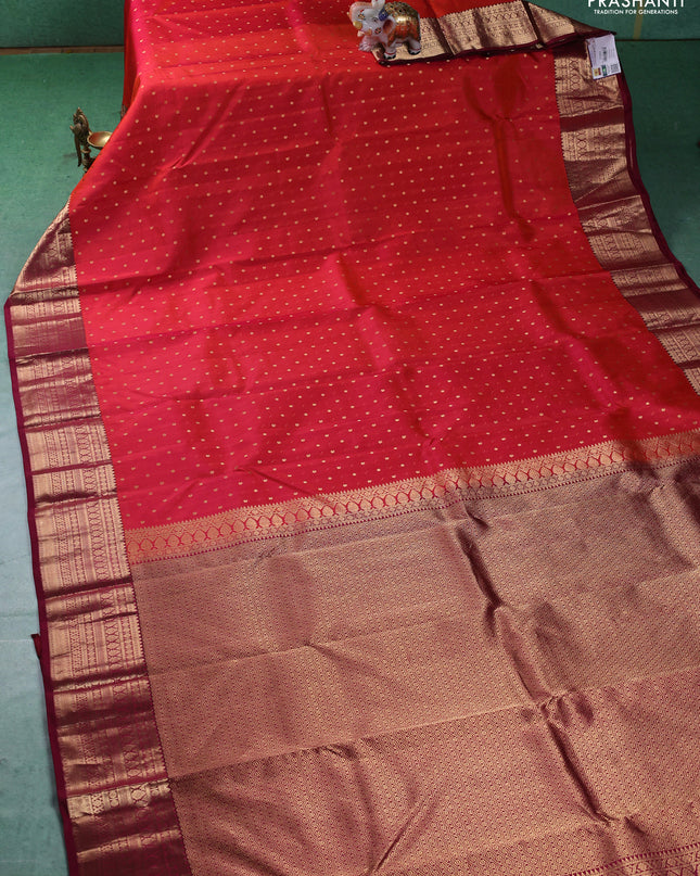 Pure kanchipuram silk saree pinish orange and dark magenta with zari woven buttas and zari woven border