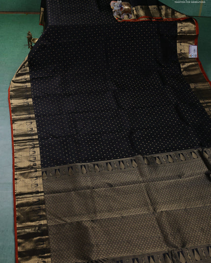 Pure kanchipuram silk saree black and orange with allover zari butta weaves and zari woven border