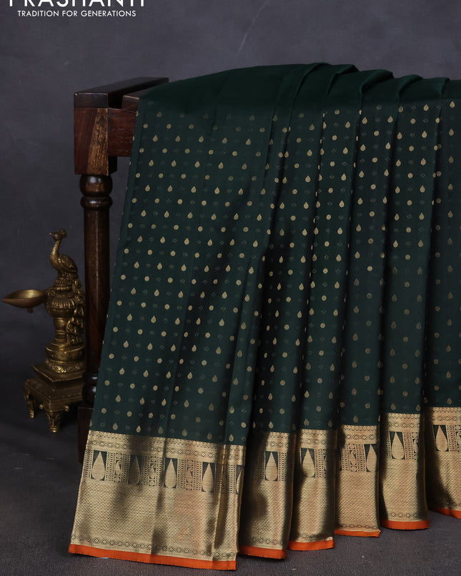 Pure kanchipuram silk saree bottle green and orange with allover zari butta weaves and zari woven border