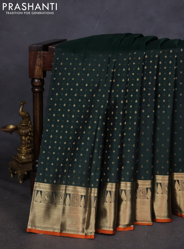 Pure kanchipuram silk saree bottle green and orange with allover zari butta weaves and zari woven border