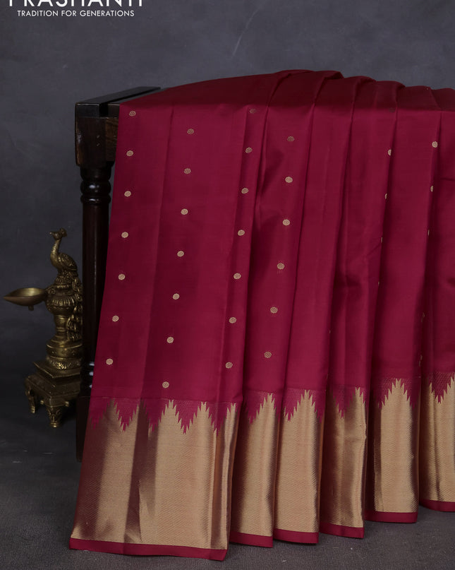 Pure kanchipuram silk saree dark pink with zari woven buttas and temple design zari woven border