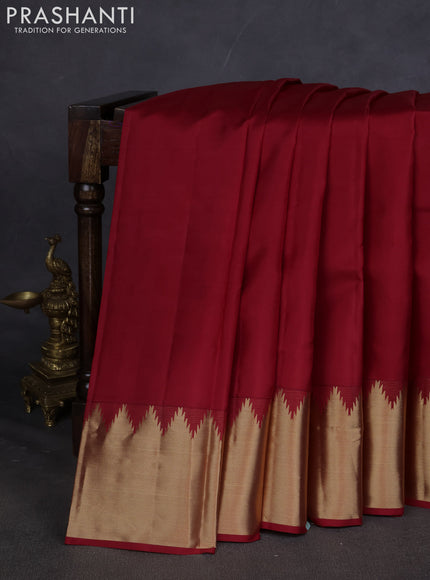 Pure kanchipuram silk saree maroon with plain body and temple design zari woven border