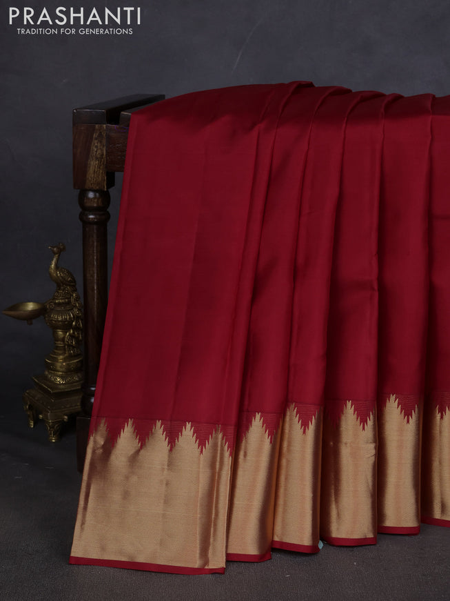 Pure kanchipuram silk saree maroon with plain body and temple design zari woven border