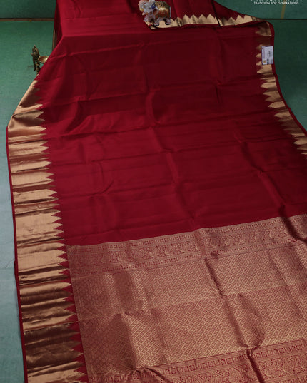 Pure kanchipuram silk saree maroon with plain body and temple design zari woven border