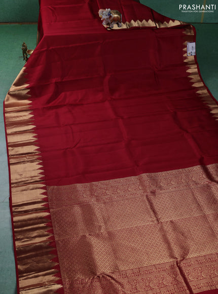 Pure kanchipuram silk saree maroon with plain body and temple design zari woven border