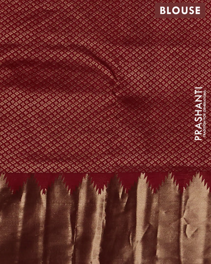 Pure kanchipuram silk saree maroon with plain body and temple design zari woven border