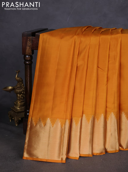 Pure kanchipuram silk saree mustard yellow with plain body and temple design zari woven border