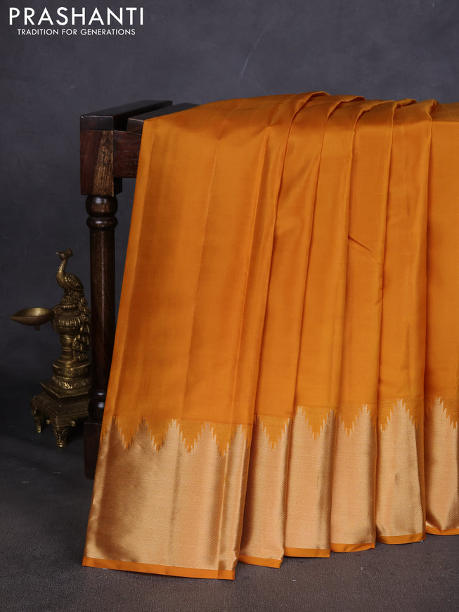 Pure kanchipuram silk saree mustard yellow with plain body and temple design zari woven border