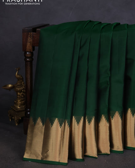 Pure kanchipuram silk saree green with plain body and temple design zari woven border