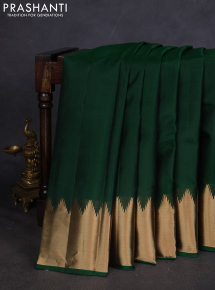 Pure kanchipuram silk saree green with plain body and temple design zari woven border
